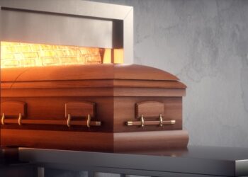 Coffin being cremated in a crematorium.